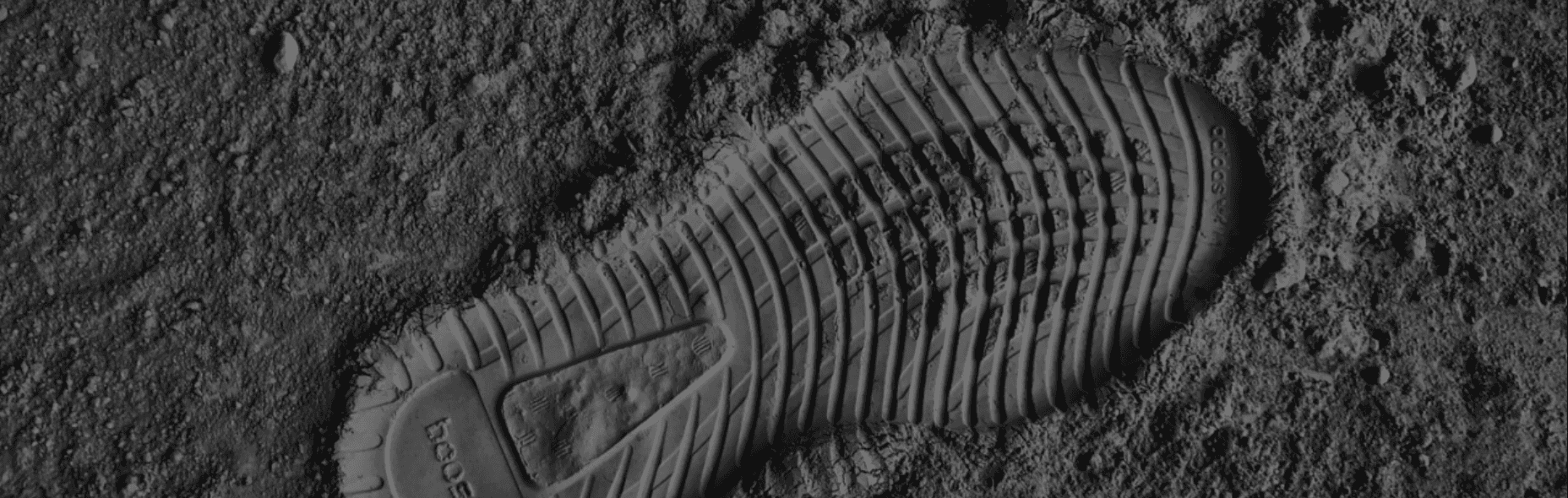 Treadlite's landing page: a footprint pressed into dark soil